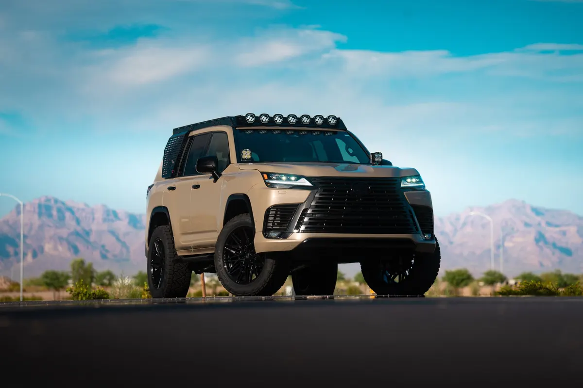 The custom Lexus LX 700h Overtrail upfitted by Westcott Designs, lifted on 22-inch wheels with a light bar